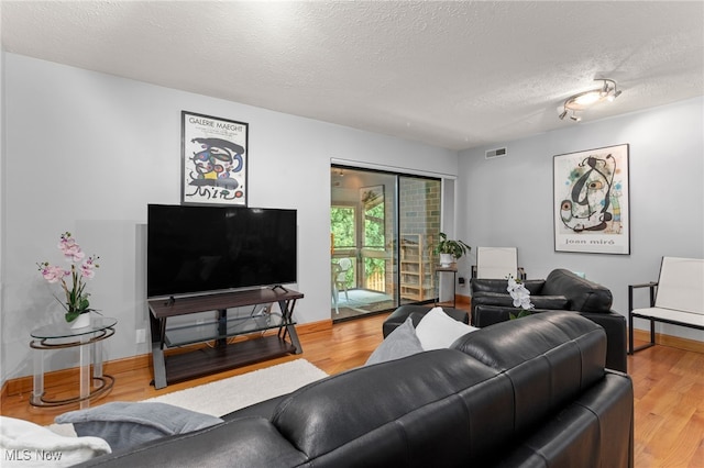 22936 Mastick Rd, Fairview Park, OH 44126 - living area featuring a textured ceiling and wood finished floors