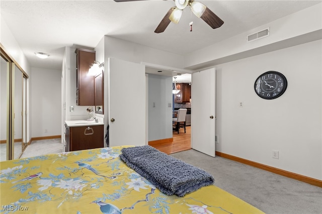 22936 Mastick Rd, Fairview Park, OH 44126 - bedroom featuring light colored carpet, connected bathroom, a closet, and a ceiling fan