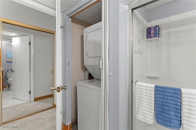 22936 Mastick Rd, Fairview Park, OH 44126 - washroom with estacked washer and dryer and light carpet