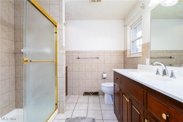 3945 Palisades Dr, Weirton, WV 26062 - full bath featuring vanity, a shower stall, tile patterned floors, tile walls, and a wainscoted wall