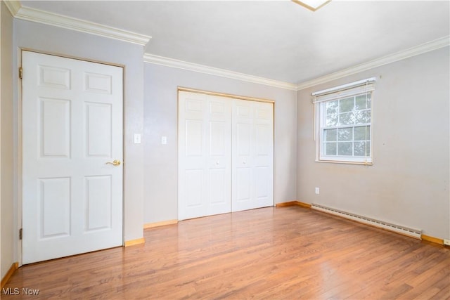 3945 Palisades Dr, Weirton, WV 26062 - unfurnished bedroom with baseboard heating, light wood-style flooring, a closet, and ornamental molding