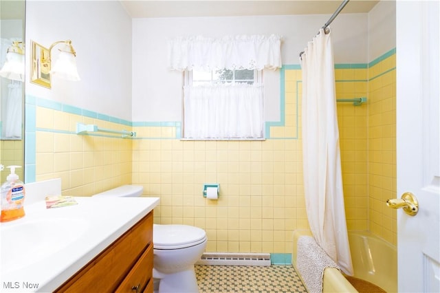 3945 Palisades Dr, Weirton, WV 26062 - bathroom with a baseboard radiator, vanity, tile walls, shower / bath combo, and wainscoting