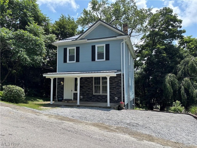 600 Marcus St, East Liverpool, OH 43920 - view of front facade with a porch, a chimney, and stone siding