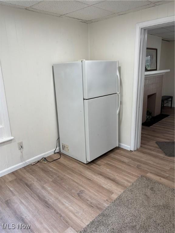 600 Marcus St, East Liverpool, OH 43920 - kitchen featuring freestanding refrigerator, light wood finished floors, a fireplace, and a paneled ceiling