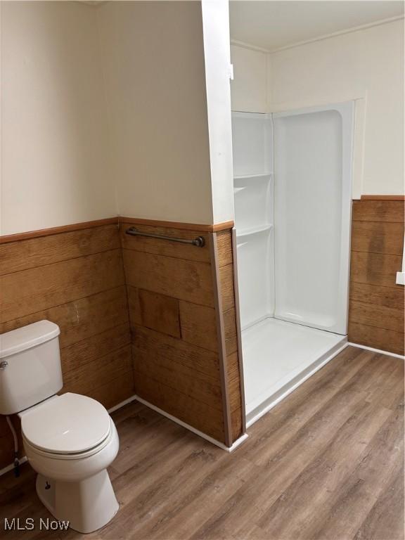 600 Marcus St, East Liverpool, OH 43920 - full bath with a stall shower, wood finished floors, a wainscoted wall, and wood walls