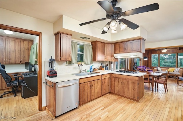 5552 Briarcliff Dr, Garfield Heights, OH 44125 - kitchen with stainless steel dishwasher, white gas stovetop, light wood-style floors, a ceiling fan, and under cabinet range hood