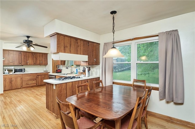 5552 Briarcliff Dr, Garfield Heights, OH 44125 - dining area featuring light wood-style floors and ceiling fan