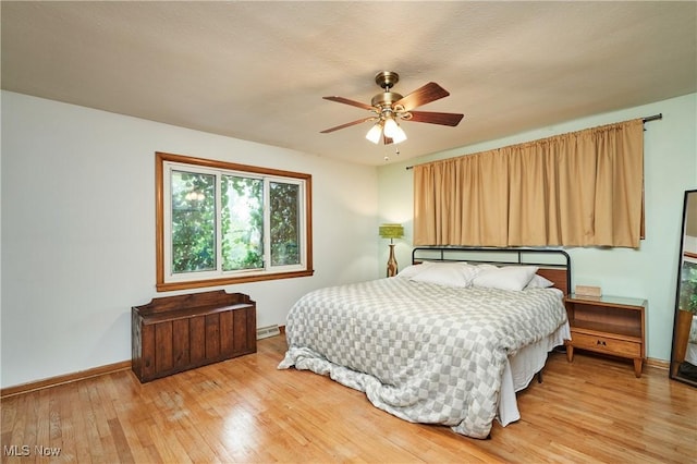 5552 Briarcliff Dr, Garfield Heights, OH 44125 - bedroom with light wood finished floors and a ceiling fan