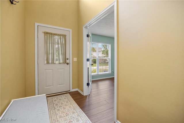 9034 Huxley Ln, Olmsted Twp, OH 44138 - entryway featuring dark wood finished floors and baseboards