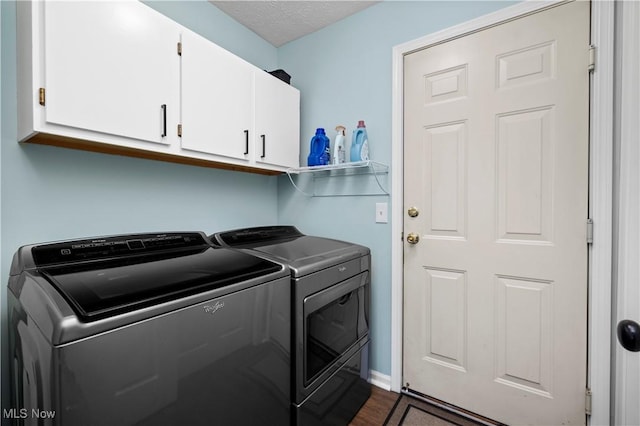 9034 Huxley Ln, Olmsted Twp, OH 44138 - laundry area with cabinet space, separate washer and dryer, and dark wood-type flooring