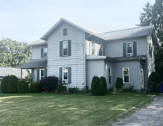 574 Spring St, Struthers, OH 44471 - view of front facade with a front lawn and a shingled roof