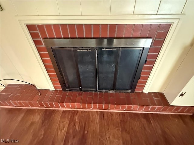 62239 Hillcrest Rd, Barnesville, OH 43713 - detailed view of wood finished floors and a tile fireplace