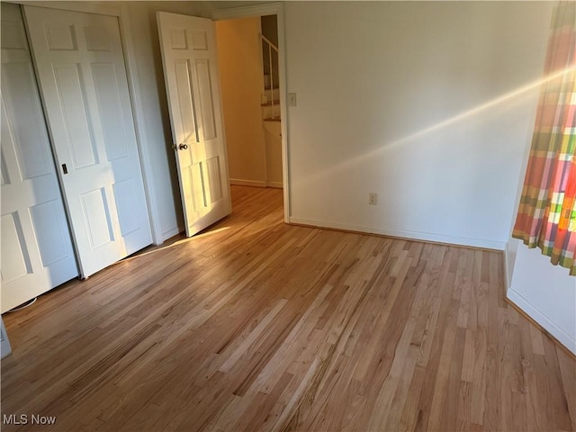 62239 Hillcrest Rd, Barnesville, OH 43713 - unfurnished bedroom with light wood-style flooring and baseboards