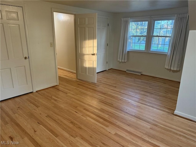 62239 Hillcrest Rd, Barnesville, OH 43713 - unfurnished bedroom featuring light wood-style flooring and baseboards