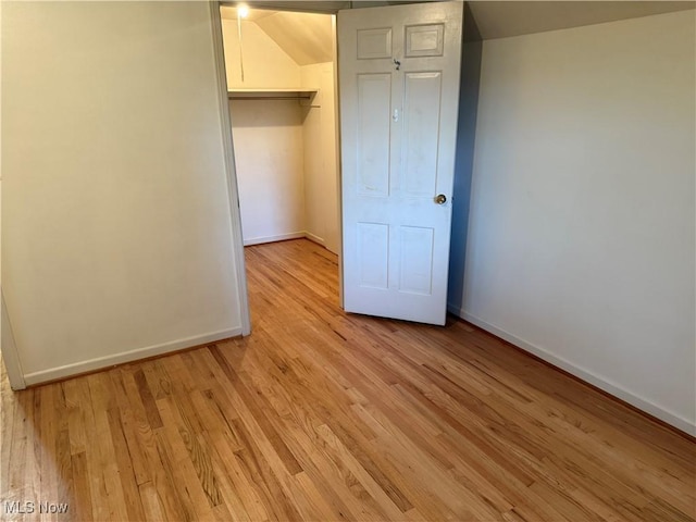 62239 Hillcrest Rd, Barnesville, OH 43713 - unfurnished bedroom with baseboards and light wood-style flooring