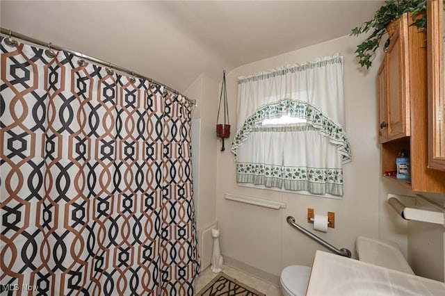 1266 Pitkin Ave, Akron, OH 44310 - bathroom with a shower with curtain and tile patterned flooring