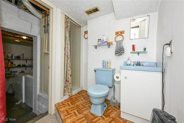 1266 Pitkin Ave, Akron, OH 44310 - full bathroom featuring washer and clothes dryer, a shower with curtain, a textured ceiling, and vanity