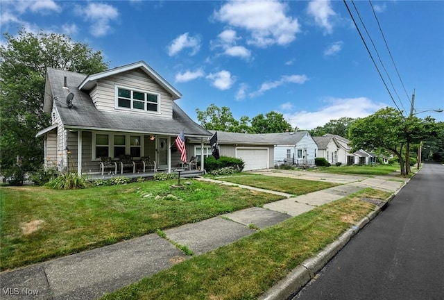 1266 Pitkin Ave, Akron, OH 44310 - bungalow-style house with a porch, driveway, a front yard, and a garage