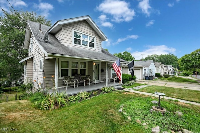 1266 Pitkin Ave, Akron, OH 44310 - bungalow with a porch, a front lawn, a garage, and driveway