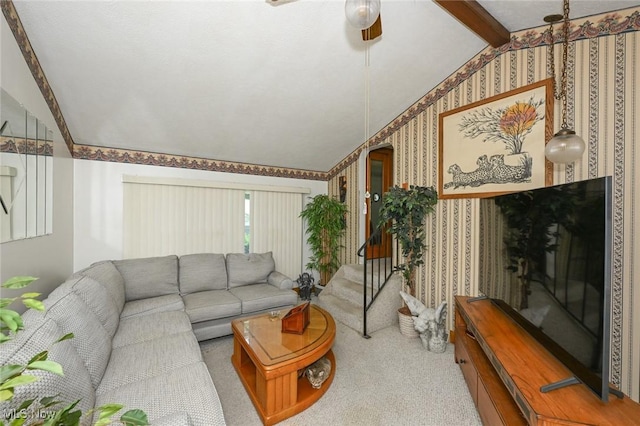 1266 Pitkin Ave, Akron, OH 44310 - carpeted living room with vaulted ceiling, wallpapered walls, a ceiling fan, and stairs