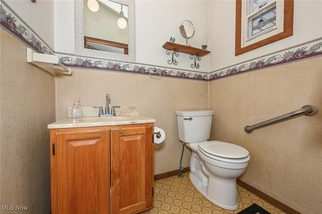 1266 Pitkin Ave, Akron, OH 44310 - bathroom featuring vanity, a wainscoted wall, and tile patterned floors