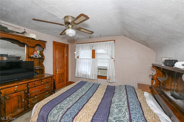 1266 Pitkin Ave, Akron, OH 44310 - bedroom with a textured ceiling, lofted ceiling, ceiling fan, carpet floors, and cooling unit