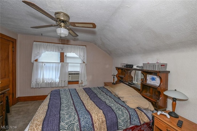 1266 Pitkin Ave, Akron, OH 44310 - carpeted bedroom featuring a textured ceiling, vaulted ceiling, ceiling fan, and cooling unit