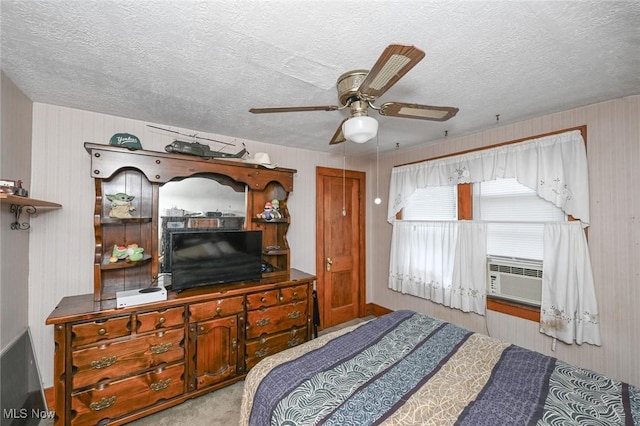 1266 Pitkin Ave, Akron, OH 44310 - carpeted bedroom with cooling unit, a textured ceiling, and a ceiling fan