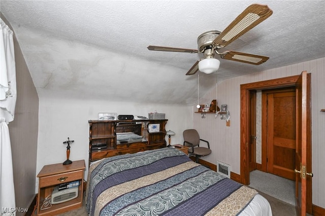 1266 Pitkin Ave, Akron, OH 44310 - bedroom featuring carpet flooring, a textured ceiling, and a ceiling fan