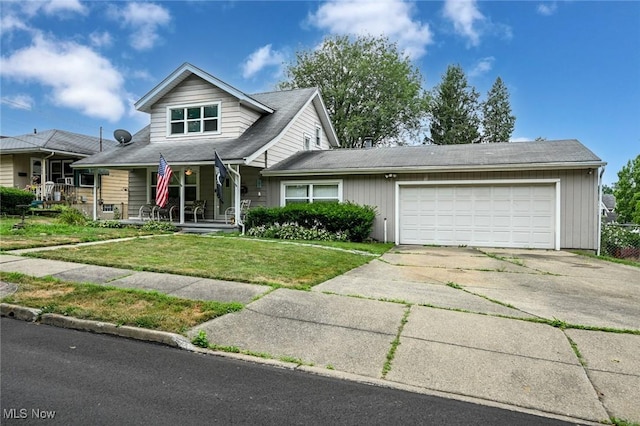 1266 Pitkin Ave, Akron, OH 44310 - view of front of house with driveway, a front yard, a garage, and a porch