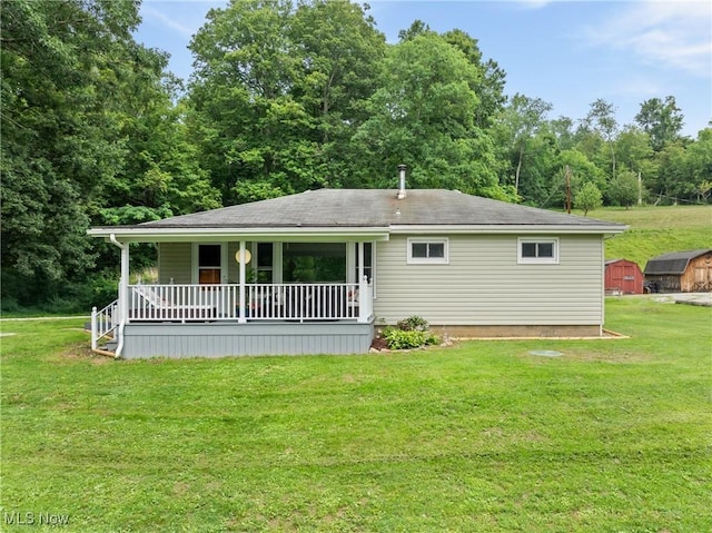 71050 Barries Dr, Martins Ferry, OH 43935 - rear view of property featuring a shed, a yard, covered porch, and roof with shingles