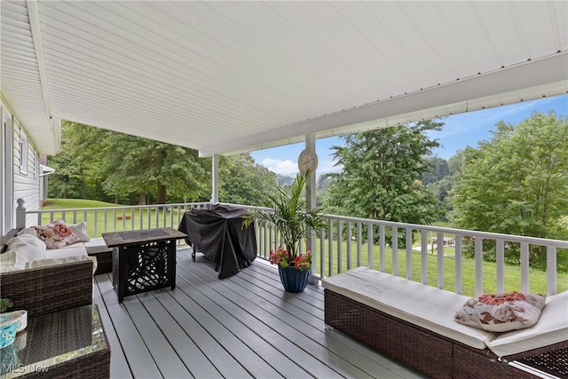 71050 Barries Dr, Martins Ferry, OH 43935 - wooden deck featuring outdoor lounge area, a lawn, area for grilling, and view of wooded area