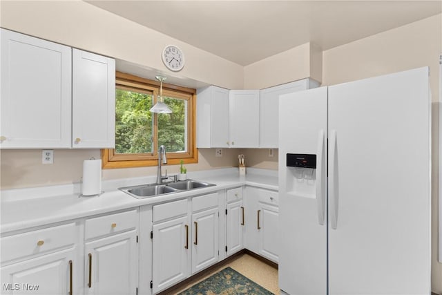 71050 Barries Dr, Martins Ferry, OH 43935 - kitchen featuring white refrigerator with ice dispenser, white cabinets, and light countertops