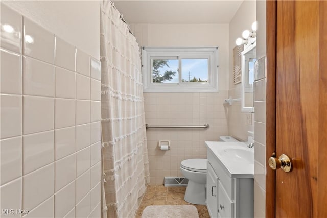 71050 Barries Dr, Martins Ferry, OH 43935 - full bathroom featuring tile walls, vanity, tile patterned floors, and a shower with shower curtain