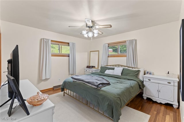71050 Barries Dr, Martins Ferry, OH 43935 - bedroom with multiple windows, wood finished floors, and ceiling fan