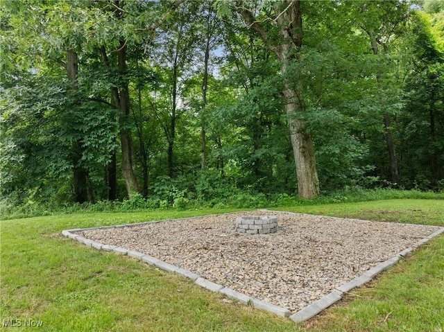71050 Barries Dr, Martins Ferry, OH 43935 - surrounding community featuring a fire pit and a lawn