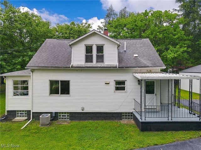 3187 Grenfall Rd, Norton, OH 44203 - rear view of property with a yard, a chimney, and roof with shingles
