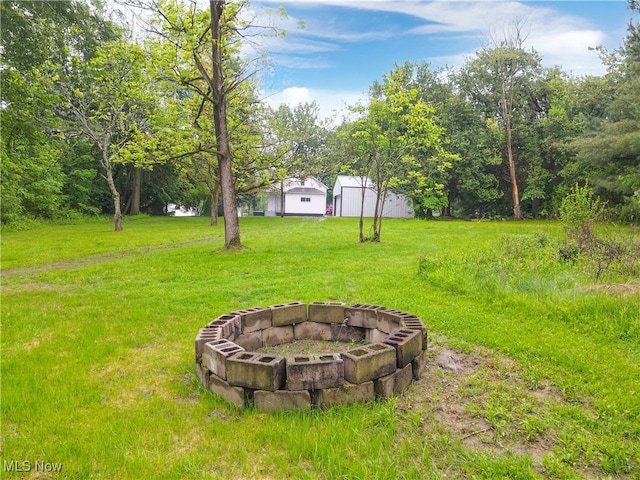 3187 Grenfall Rd, Norton, OH 44203 - view of grassy yard with a fire pit