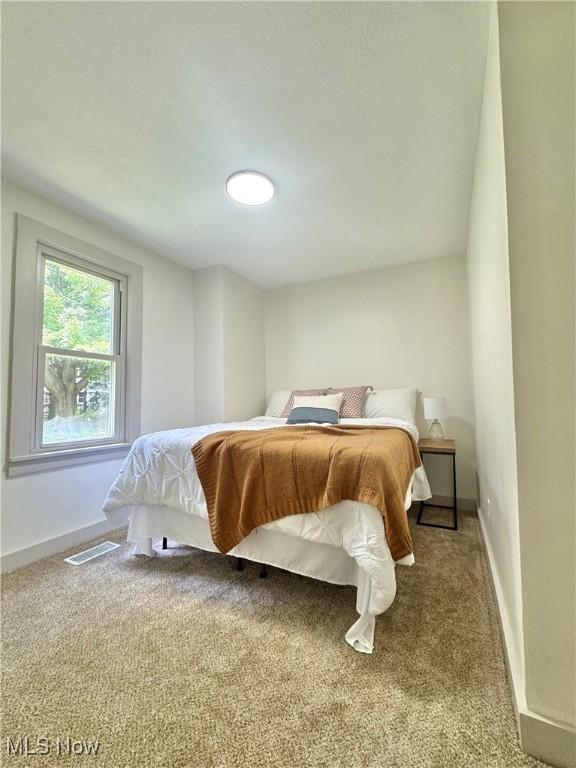 3187 Grenfall Rd, Norton, OH 44203 - carpeted bedroom with baseboards
