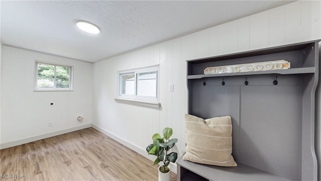 3187 Grenfall Rd, Norton, OH 44203 - mudroom featuring plenty of natural light, light wood-style flooring, and a textured ceiling