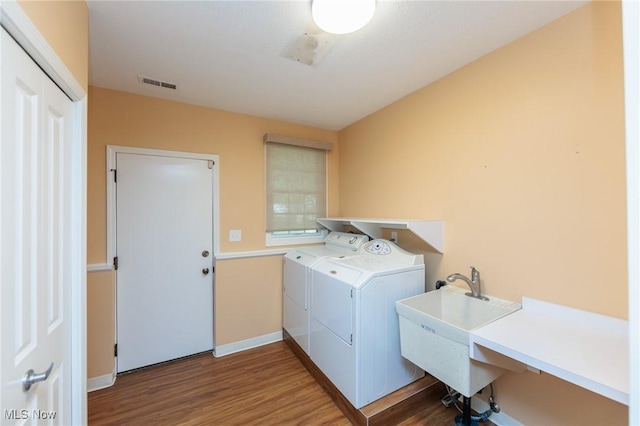 2271 Augusta Ct, Westlake, OH 44145 - laundry area featuring washer and dryer and wood finished floors