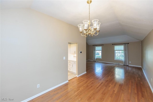 2271 Augusta Ct, Westlake, OH 44145 - empty room with vaulted ceiling, light wood-type flooring, and a chandelier