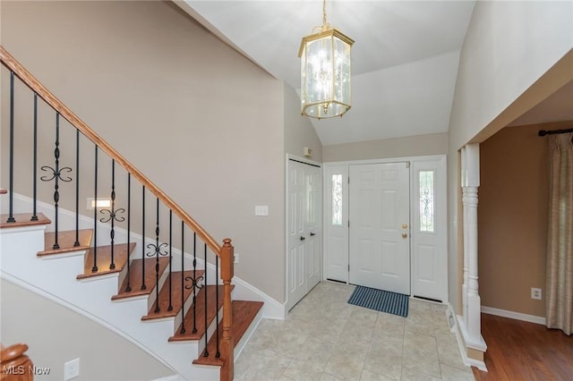 2271 Augusta Ct, Westlake, OH 44145 - tiled entryway featuring a chandelier, stairs, and high vaulted ceiling
