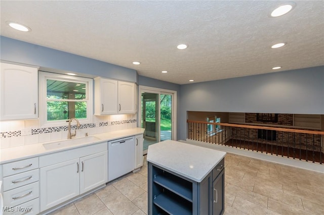 2271 Augusta Ct, Westlake, OH 44145 - kitchen featuring dishwashing machine, white cabinetry, backsplash, open shelves, and light countertops