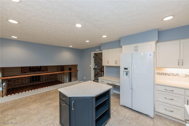 2271 Augusta Ct, Westlake, OH 44145 - kitchen with white refrigerator with ice dispenser, white cabinets, open shelves, light countertops, and recessed lighting