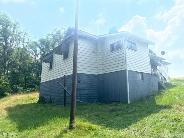 70610 Chermont Rd, Bridgeport, OH 43912 - view of property exterior with a chimney and a lawn