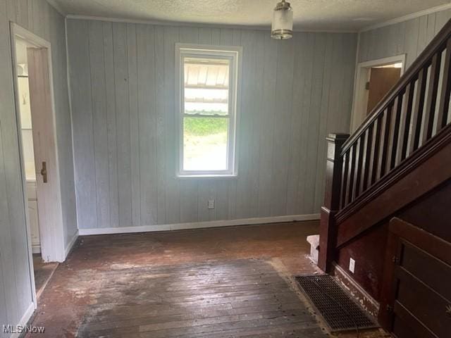 70610 Chermont Rd, Bridgeport, OH 43912 - foyer with hardwood / wood-style floors, stairway, wood walls, and crown molding