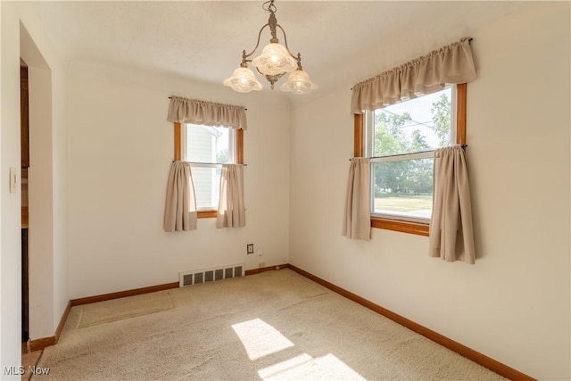 1403 Wexford Ave, Parma, OH 44134 - carpeted spare room featuring a chandelier and baseboards