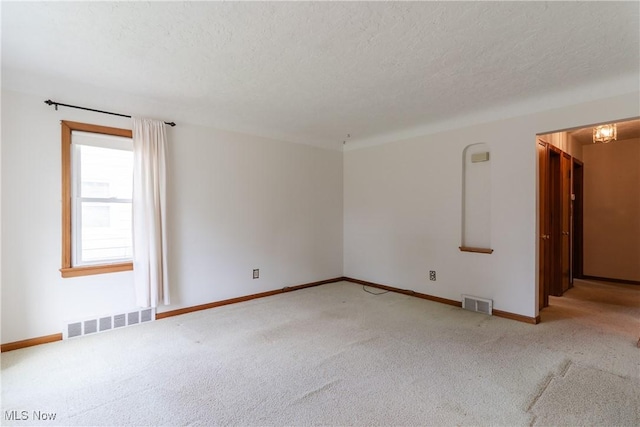 1403 Wexford Ave, Parma, OH 44134 - empty room featuring carpet floors and a textured ceiling