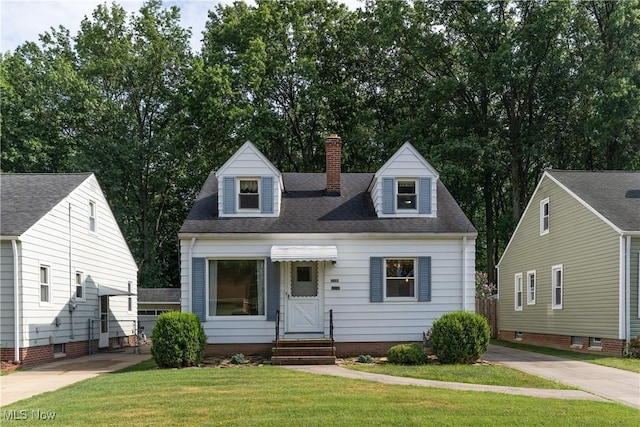 1403 Wexford Ave, Parma, OH 44134 - cape cod-style house with entry steps, a front yard, a chimney, and a shingled roof